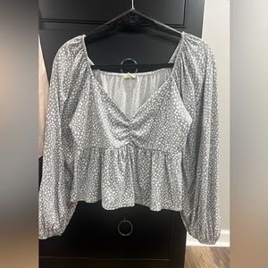 Grey shirt with white dots. Can be worn on or off the shoulder. Size small.
